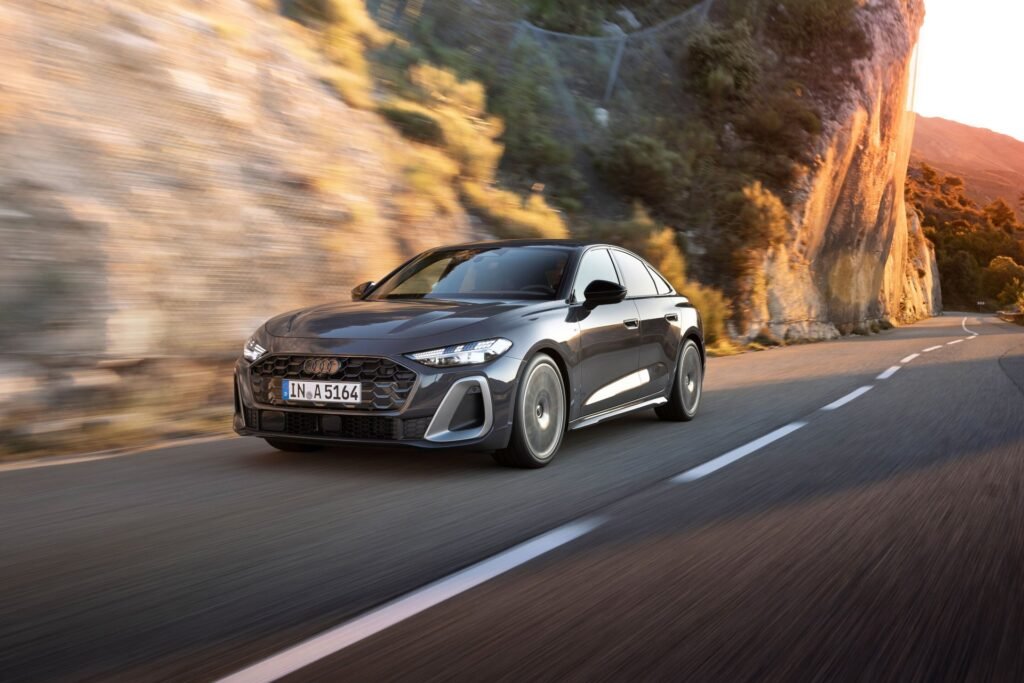 Audi A5 Sedan in Magnet Grey on a coastal road